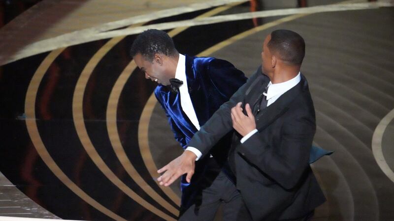 Will Smith walks onstage and slaps Oscars host Chris Rock after the comedian made a joke about Smith’s wife, Jada Pinkett Smith, at the 94th Academy Awards in Los Angeles on Sunday. Photograph: Ruth Fremson/The New York Times