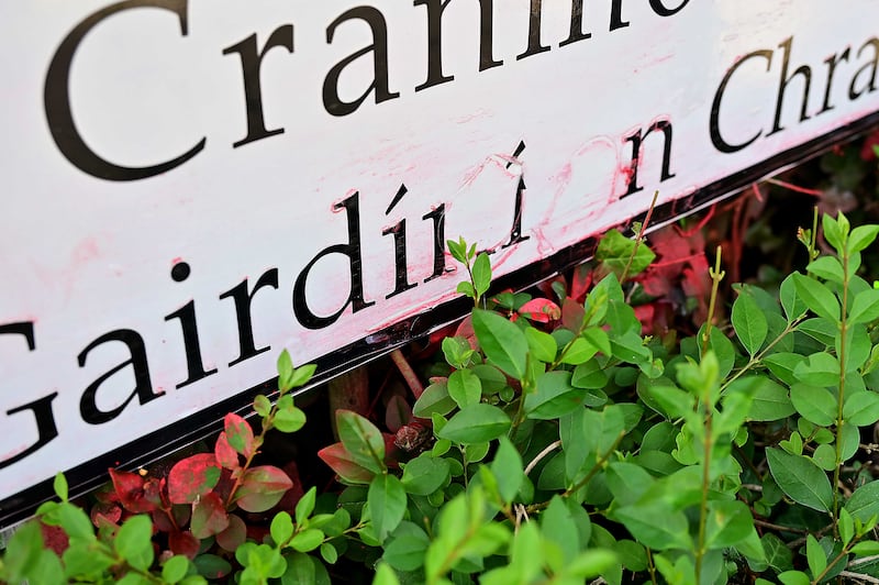 A bilingual sign on south Belfast street Carnmore Gardens was defaced, with red paint daubed over the Irish name. Photograph: Pacemaker Press