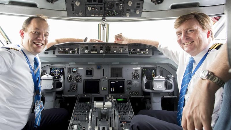 Royal flight: King Willem-Alexander (right) and fellow pilot Maarten Putman in the cockpit of their KLM Cityhopper. Photograph: Natascha Libbert/KLM/AFP/Getty