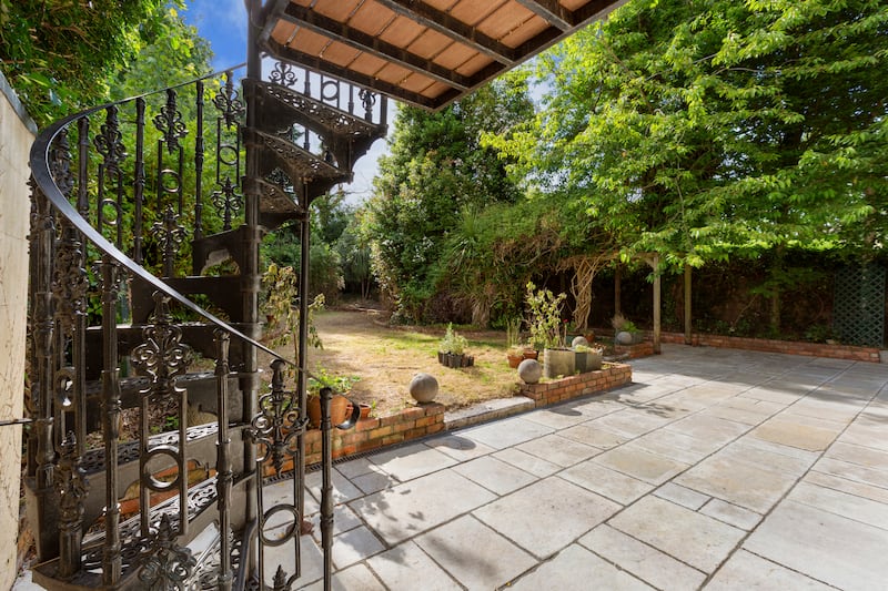 Patio with cast-iron steps to terrace