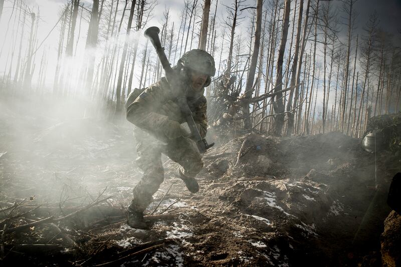A Ukrainian soldier after firing a rocket-propelled grenade at a Russian position in the Serebrianka Forest in eastern Ukrainian on February 6th. Photograph: Tyler Hicks/The New York Times
                      