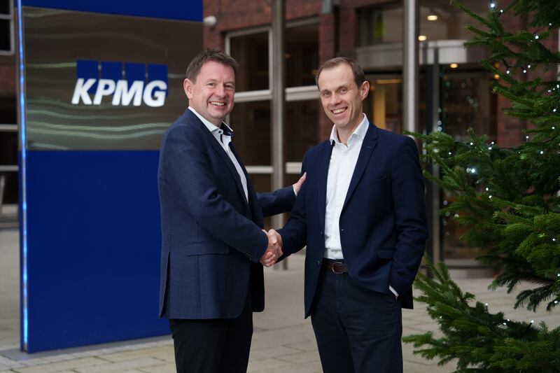 Outgoing KPMG managing partner Seamus Hand congratulates his successor Ryan McCarthy. Photograph: Fran Veale/Julien Behal Photography