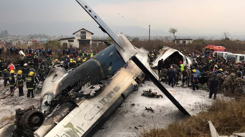 Wreckage of an airplane is pictured as rescue workers operate at Kathmandu airport, Nepal. Photograph: Navesh Chitrakar/Reuters