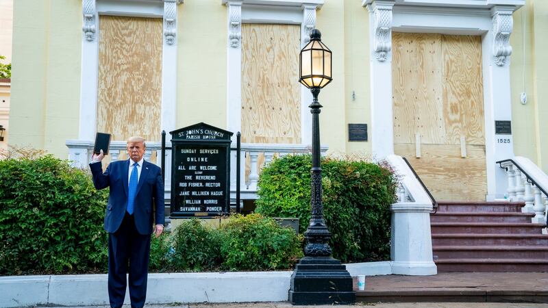 Donald Trump holds a Bible outside St John’s Church in Washington on Monday after authorities used tear gas to disrupt peaceful protests outside the White House to clear a path for the US president. Photograph: Doug Mills/The New York Times.