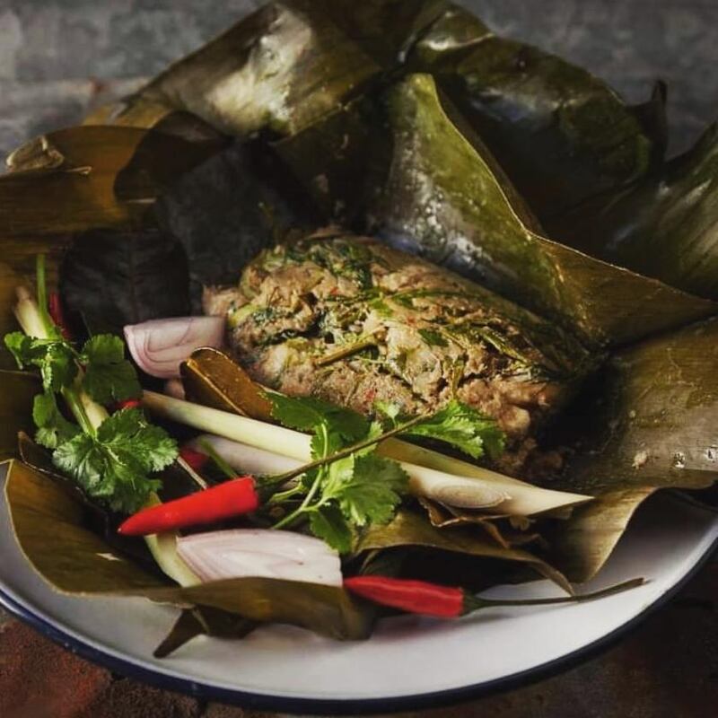 Mok Pla, grilled seabass fillets with home made curry paste, Thai herbs, sticky rice and wrapped in banana leaf, at Kin Khao Thai. Photograph: Adam Lyons
