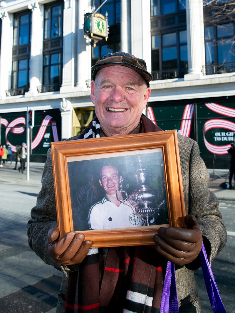 John Crowe who worked at Clery's for 46 years
with a photo of himself  winning the 1985 kickham cup won for Clerys' GAA team. Photograph: Gareth Chaney/Collins Photos