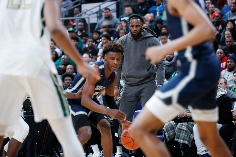 LeBron James watches son Bronny play with Sierra Canyon High School against St Vincent-St Mary High School at Nationwide Arena in Columbus, Ohio, in December 2019. Photograph: Joe Robbins/Getty 