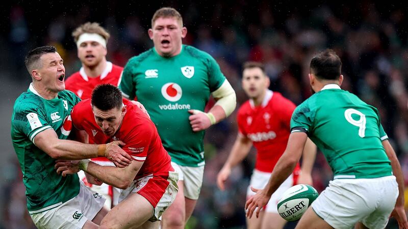 Josh Adams’s extremely dangerous late hit   on Johnny Sexton was punished by Jaco Peyper with a yellow card; it might have been more. Photograph: Ryan Byrne/Inpho