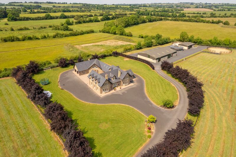 The house has equestrian facilites adjacent on its 24 acres