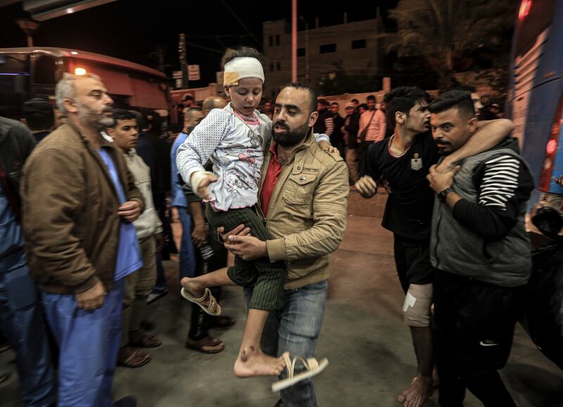Wounded people transferred from the Indonesian Hospital arrive at Nasser Medical Hospital in Khan Younis on November 21st. Photograph: Yousef Masoud/New York Times
                      
