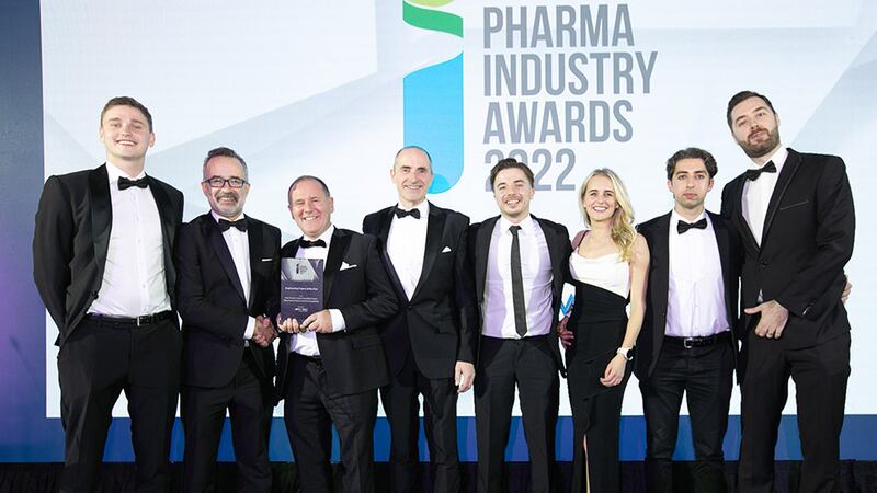 Tommy Moore, Sales Manager, BOC Gas, presents the Engineering Project of the Year award to the Pfizer Ireland Pharmaceuticals Ringaskiddy team.