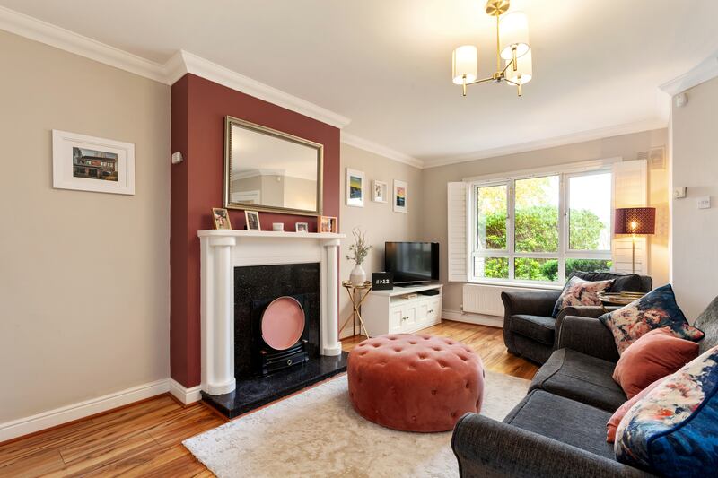 The panelled shutters on the livingroom window add a decorative feature.