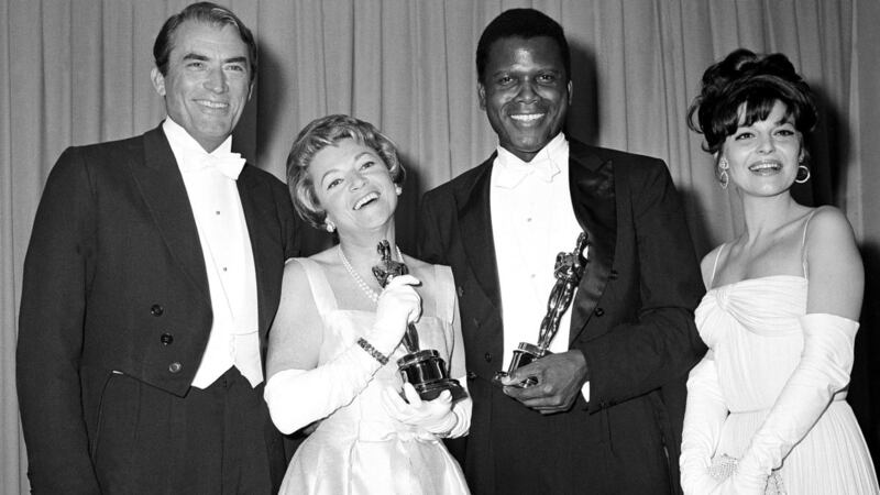 Sidney Poitier  at the 1964 Academy Awards with Gregory Peck, Annabella and Anne Bancroft. Photograph: AP