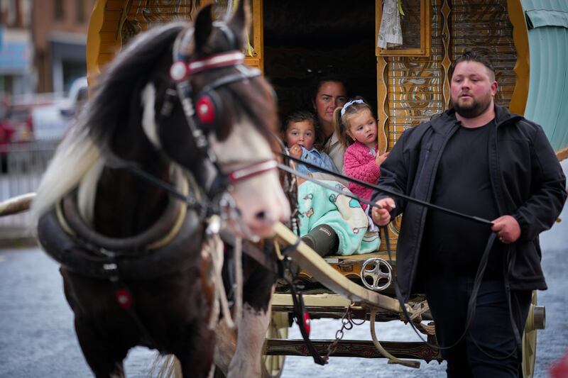A family in their traditional horse-drawn caravan make their way to the Appleby Horse Fair. Photograph: Christopher Furlong/Getty Images