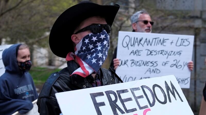 People protest against Ohio ‘stay at home’ order, issued by Gov Mike DeWine to help slow the spread of Covid-19,  in Columbus, Ohio, last week. Photograph: Matthew Hatcher/Reuters