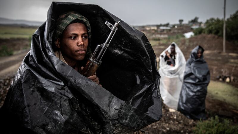 Tigray Defence Forces fighters shelter in plastic bags during a storm south of Mekelle on  June 23rd. Photograph: Finbarr O’Reilly/New York Times