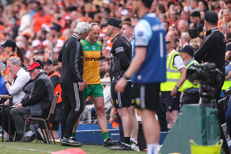 Donegal manager Jim McGuinness with Michael Murphy after he was taken off during extra-time of the Ulster SFC final. Photograph: Ben Brady/Inpho