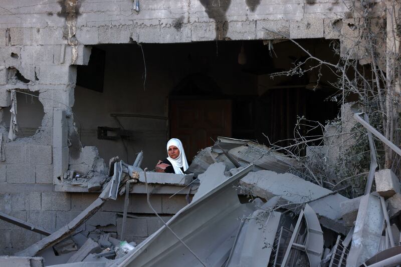 A woman sits amid the rubble of a building destroyed in an Israeli bombardment in Rafah in the southern Gaza Strip on October 21st, 2023. Photograph: SAID KHATIB/AFP via Getty Images