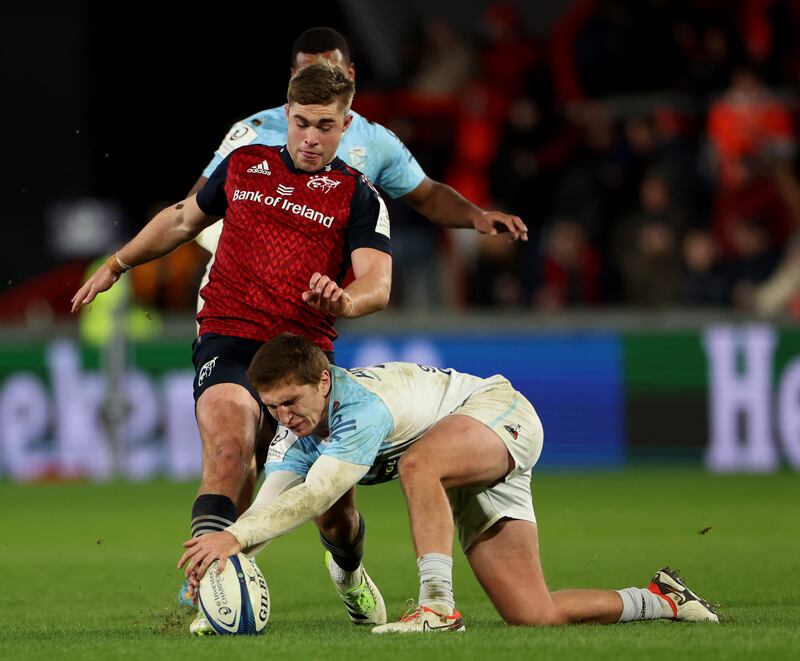 Munster’s Jack Crowley is challenged  by Thomas Dolhagaray of Bayonne during the Investec Champions Cup game at Thomond Park. Photograph: James Crombie/Inpho 