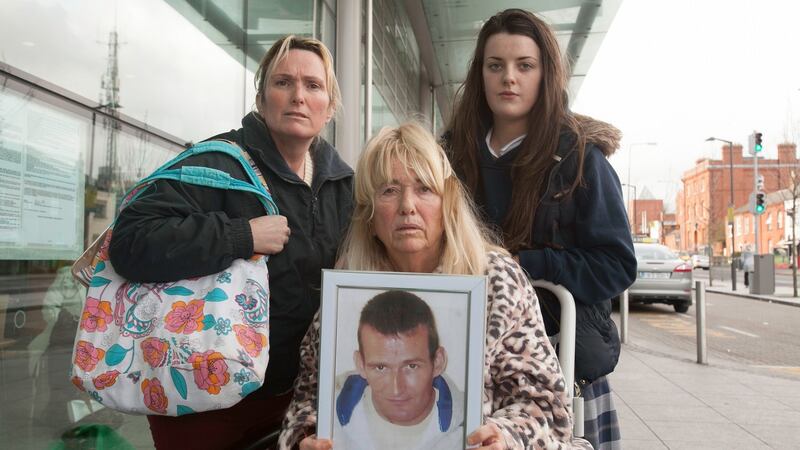From left Derek Devoy’s sister Antoinette Corbally, her mother Anne Devoy and her neice Andrea Devoy. Anne Devoy is holding a picture of Michael Devoy who was shot dead in 2014. File photo: Gareth Chaney Collins