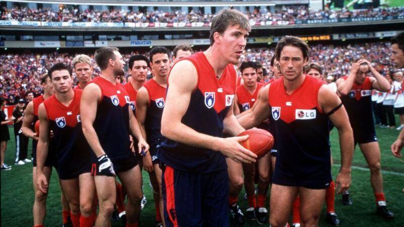 Jim Stynes was honoured by team mates during the 1999 round 1 of the AFL season between Melbourne Demons v Richmond Tigers at the Melbourne Cricket Ground, Australia. Photograph: Hamish Blair/Getty Images