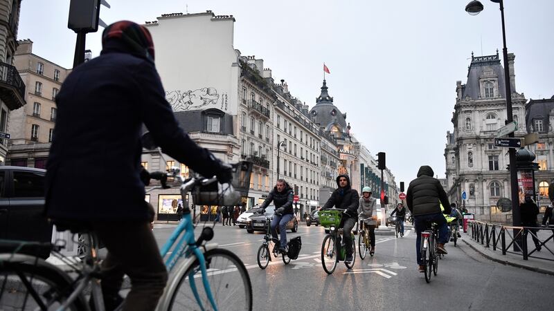 Locals ride bicycles to go to work during a national strike action on Rivoli Street near  City Hall in Paris on Thursday. Photograph: Julien De Rosa