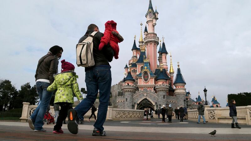 Visitors at the Sleeping Beauty Castle during a visit to Disneyland Paris. Photograph: Gonzalo Fuentes/Reuters
