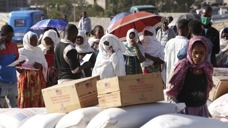 Tigray people, taking shelter in Mekelle city, receive  food aid distributed by United States Agency for International Development (USAID). Photograph: Minasse Wondimu Hailu/ Anadolu Agency via Getty