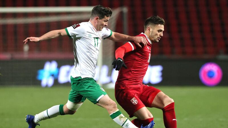 Dusan Tadic of Serbia is challenged by Josh Cullen during the World Cup qualifier  in Belgrade. Photograph: Srdjan Stevanovic/Getty Images