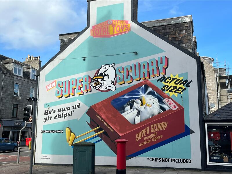 A mural in central Aberdeen of a pretend advertisement for a seagull toy