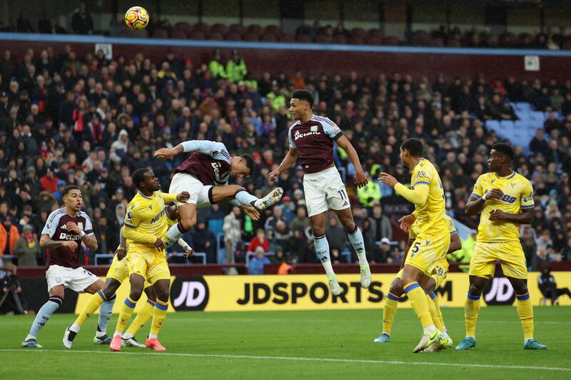 Ollie Watkins heads the ball on goal. Photograph: Eddie Keogh/Getty Images