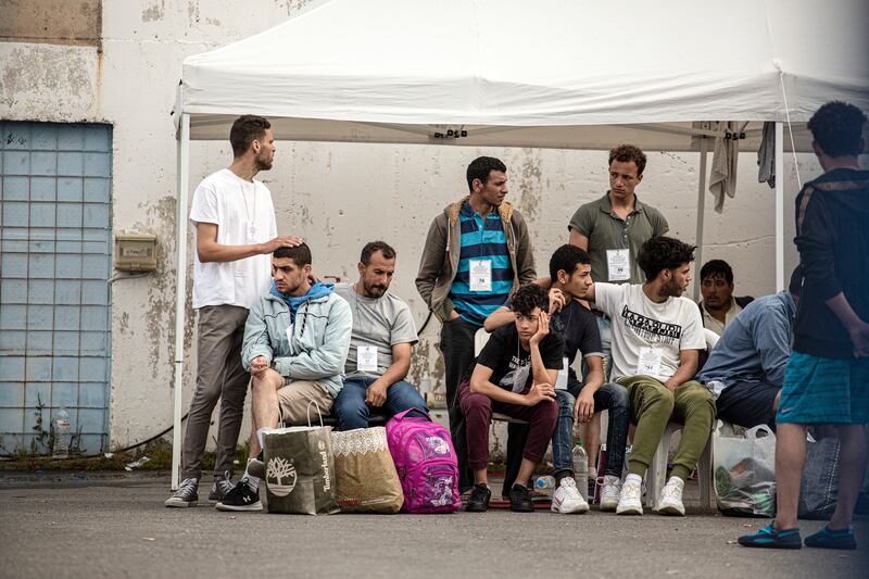 Survivors of the Adriana shipwreck wait to be transported to a refugee camp in Kalamata, Greece, on June 15th. Photograph: Eirini Vourloumis/New York Times
                      
