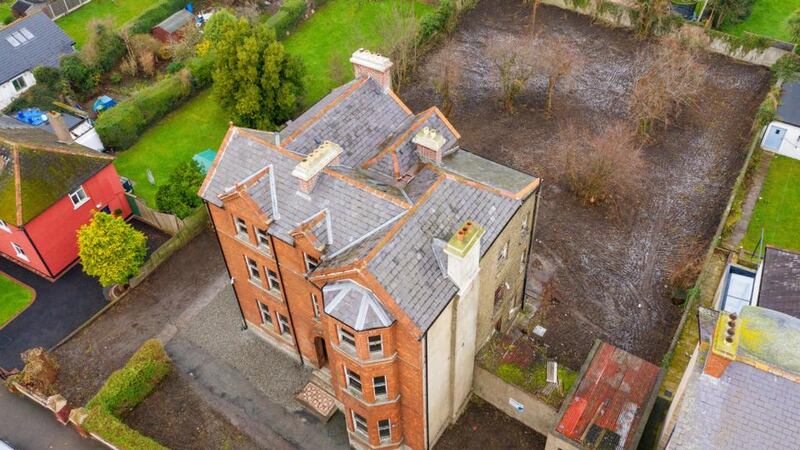 Aerial view of property and gardens.