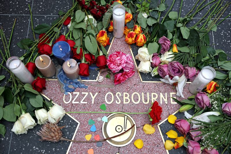 Flowers left at a makeshift memorial at Ozzy Osbourne's star on the Hollywood Walk of Fame in Los Angeles following his death. Photograph:  Patrick T Fallon/AFP via Getty Images          