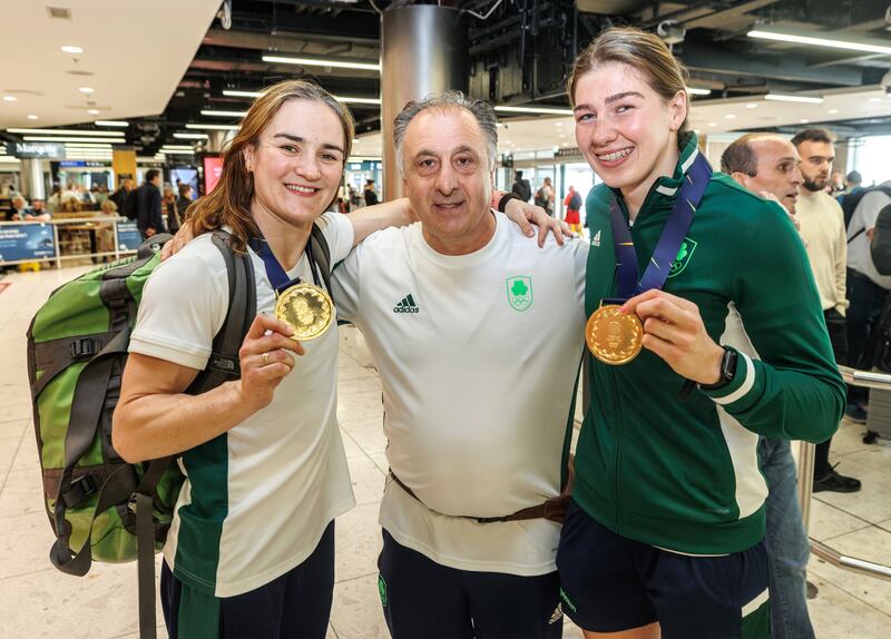 Boxers Kellie Harrington and Aoife O’Rourke with coach Zaur Antia at Dublin Airport in July after winning gold medals at the European Games in Poland. European Games. Photograph: James Crombie/INPHO