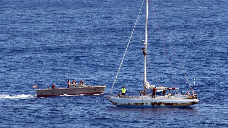 Sailors from the USS Ashland prepare to rescue  two  women and their dogs from a yacht in the Pacific Ocean. Photograph: Mass communication specialist 3rd class Jonathan Clay/US navy via AP