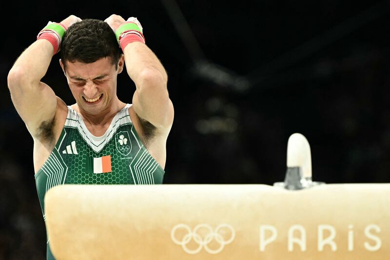 Rhys McClenaghan reacts after competing in the artistic gymnastics men's pommel horse final at Olympic Games in Paris, where he won gold. Photograph: Lionel Bonaventure/AFP via Getty Images