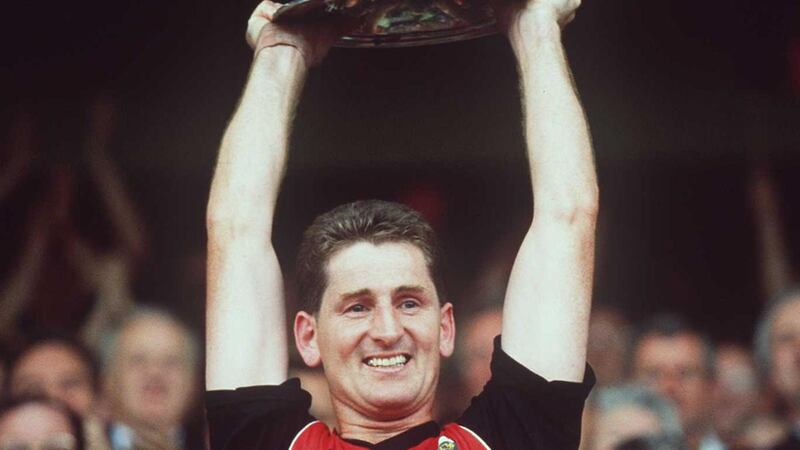 Down captain Paddy O’Rourke lifts the Sam Maguire after the win over Meath in 1991. Photograph: James Meehan/Inpho