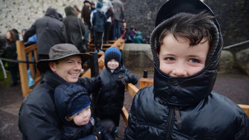 Liam Donegan with sons Bill, Ollie and Frankie from Terenure in the rain outside Newgrange on the morning of the Winter Solstice. Rain and cloud on the horizon at sunrise blocked  sunlight from entering the chamber. Photograph: Alan Betson/The Irish Times