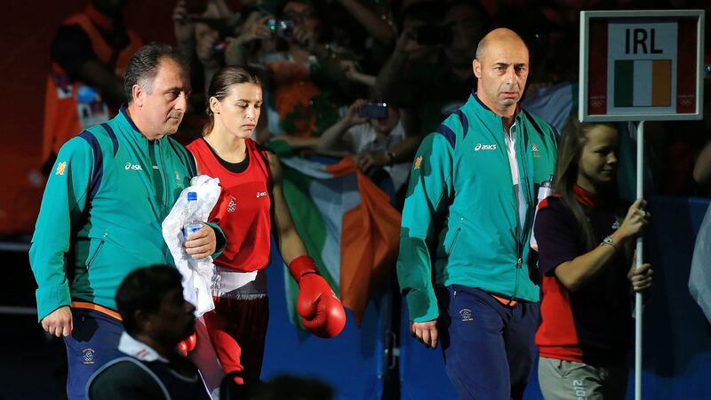 Katie Taylor walks to the ring with her father Pete and Ireland coach Zaur Antia ahead of the final. Photograph: Dan Sheridan/Inpho