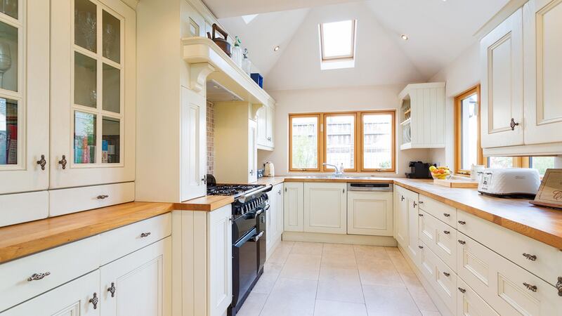 Hardwood worktops, a black Rangemaster and three ceiling Velux windows:  the kitchen at 2 Northbrook Villas