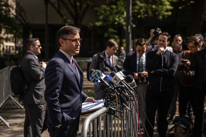 
                        House Speaker Mike Johnson (R-La.) speaks to reporters at Collect Pond Park outside of former President Donald Trump's criminal trial in New York, May 14, 2024. Johnson accused prosecutors of advancing a “sham” trial against “one president to provide cover for another.”  (Dave Sanders/The New York Times)
                      