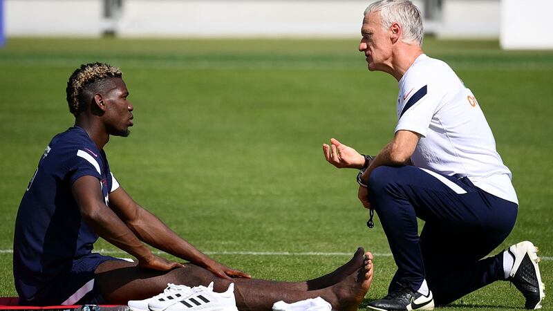 France’s mdfielder Paul Pogba (L) speaks with France’s head coach Didier Deschamps at the end of a training session in Munich, Germany, on Wednesday. Photograph: Franck Fife/AFP via Getty Images