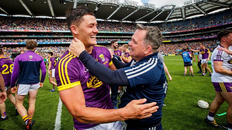Wexford’s Lee Chin celebrates with manager Davy Fitzgerald after the the Leinster final victory over Kilkenny. Photograph: Ryan Byrne/Inpho