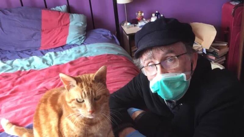 Kevin Higgins with his cat, Ziggy