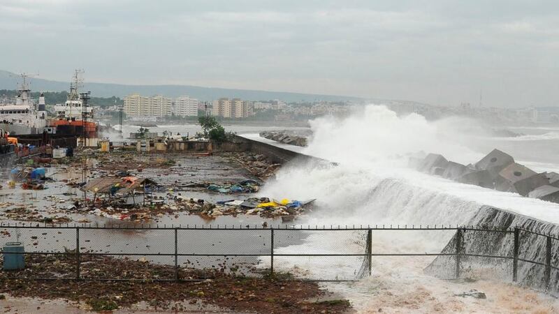 Waves crash onto the shore at a fishing harbour in Visakhapatnam district in the southern Indian state of Andhra Pradesh this morning. Photograph: R Narendra/Reuters