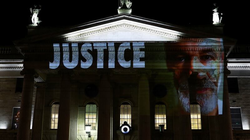 Projections showing victims of clerical abuse are seen on the GPO in Dublin on Friday evening  as part of a protest ahead of the visit by Pope Francis. Reuters/Hannah McKay