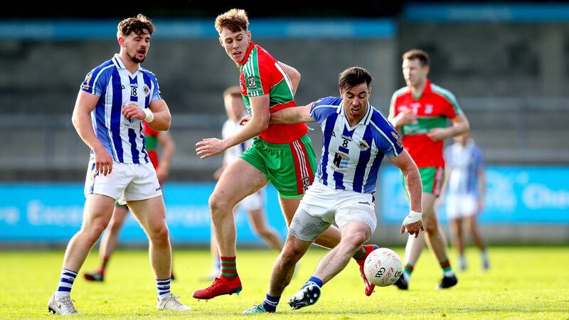 Ballyboden St Enda’s Michael Darragh Macauley and Cameron McCormack of Ballymun Kickhams struggle for the ball. Photograph: Ryan Byrne/Inpho