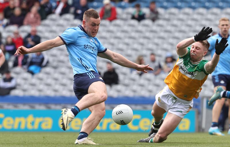 Dublin's Con O’Callaghan scores a goal despite the efforts of Lee Pearson of Offaly, with a lot of empty seats in the background. Photograph: Bryan Keane/Inpho