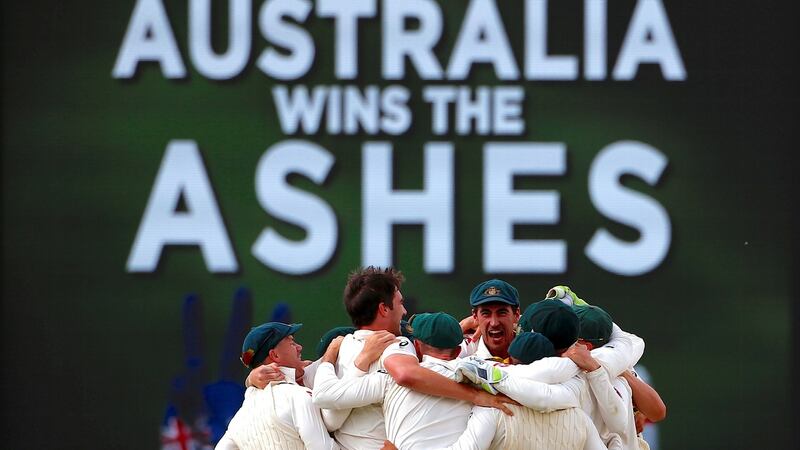 Australia players celebrate at the end of the game. David Gray/Reuters